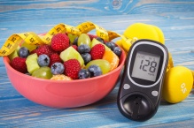 Fruit, measuring tape, weights, diabetes monitor. 