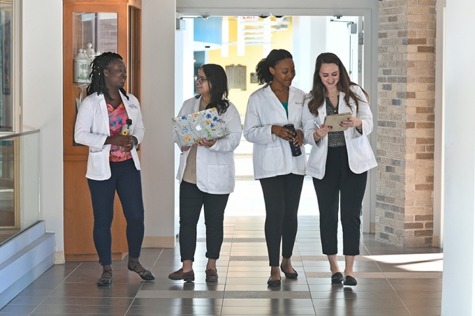 UB Pharmacy students walking. 
