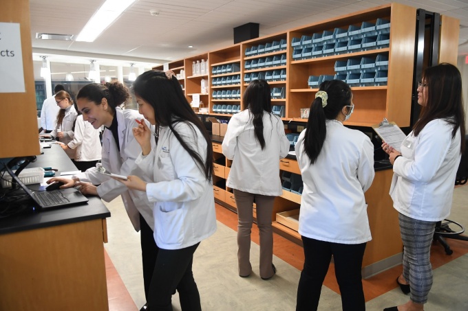 UB Pharmacy students working in Model Pharmacy. 