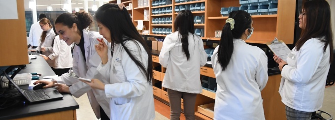 SPPS students working in Model Pharmacy. 