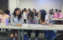 Zoom image: PSI students mock reviewing PharmD admissions applications. 