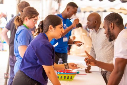 SPPS student distributing supplies to patients in Ghana. 