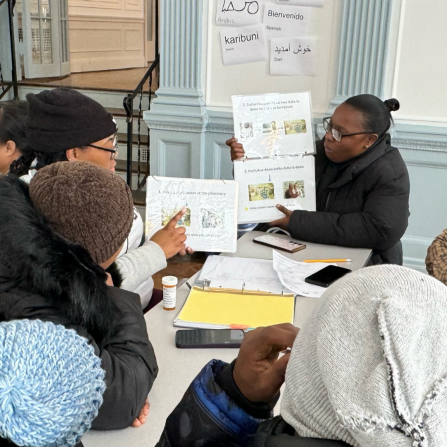 PharmD students educate local refugees on medication management. 