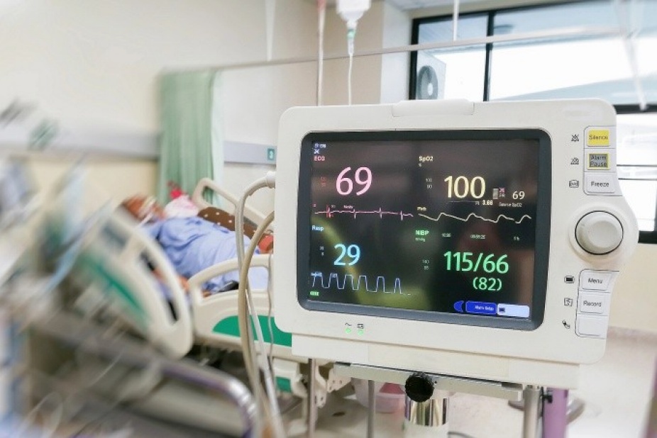Cardiac monitor along hospital patient. 
