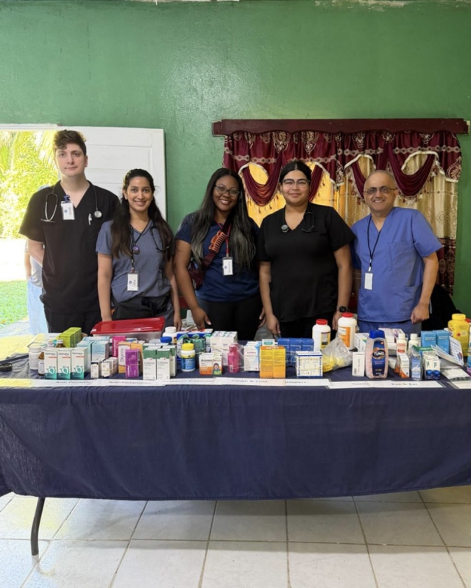 SPPS students and faculty preparing medications at clinic in Belize. 